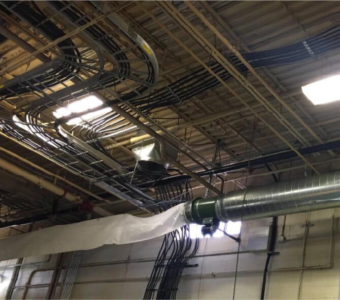 Pipes and vents on ceiling of factory building