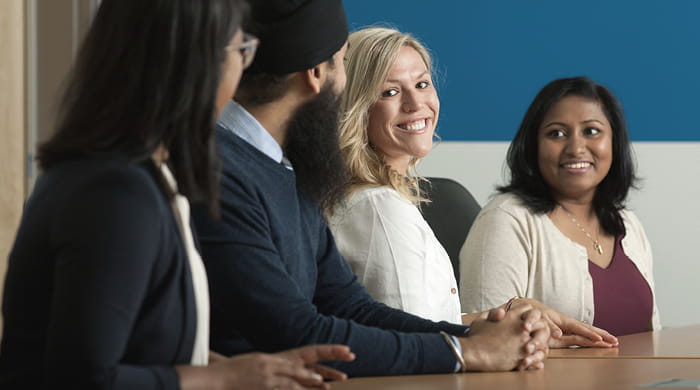 Employees sitting at a table