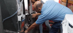 HVAC inspecting a gas furnace