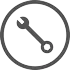 A black and white circle featuring a wrench.