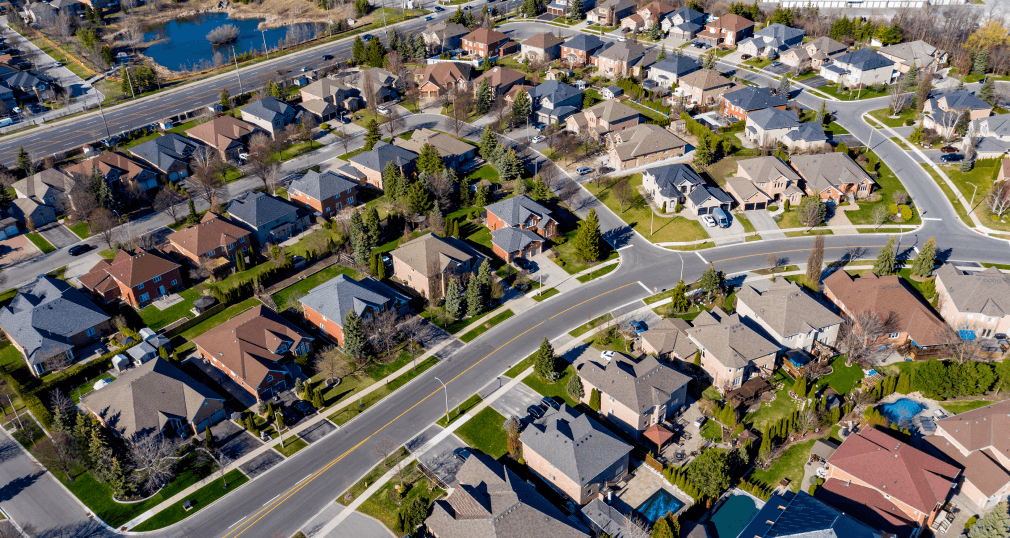 Aerial view of a subdivision at dusk.