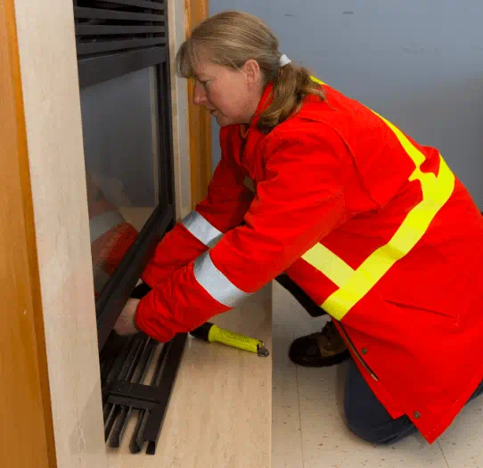 Technician working on a fireplace