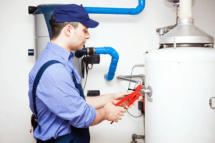 Technician working on water heater