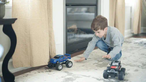 Child enjoying natural gas fireplace