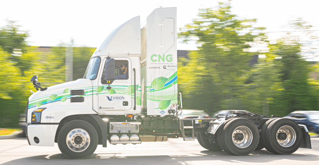 Person driving a CNG highway tractor.