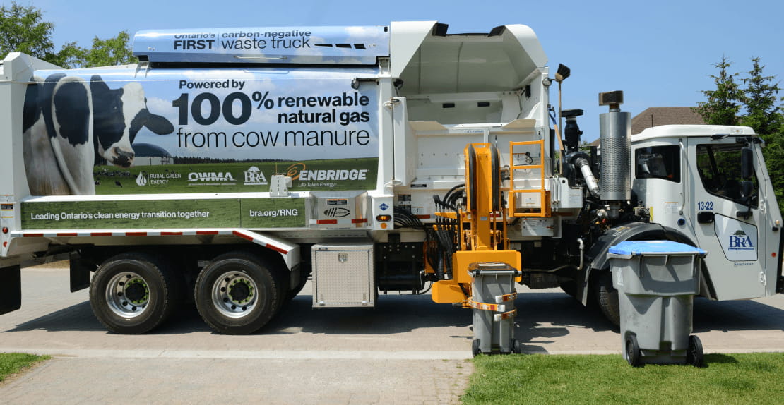 Recycling and garbage being collected by a truck fuelled with one hundred percent renewable natural gas made from cow manure.