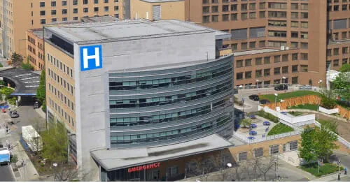 Urban area with large hospital in foreground.