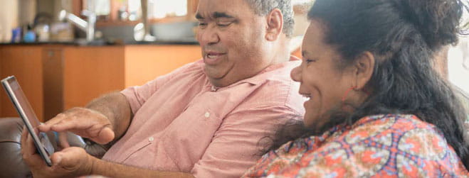 Two people looking at tablet