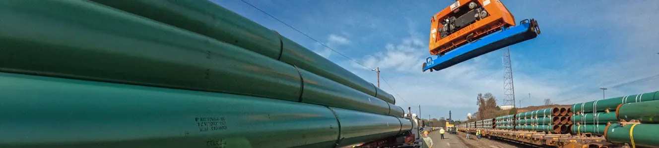 A large green pipes on a truck