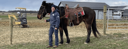 Enbridge Gas Ohio customer service representative Jody Shaw holding a horse