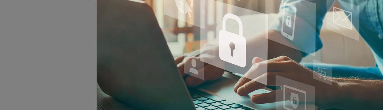 A person typing on a laptop computer and a security lock graphics