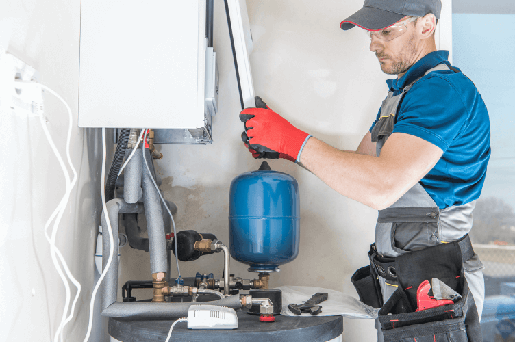 A professional overseeing a central gas heater installation