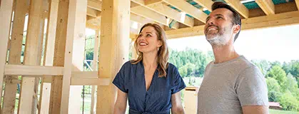 Couple visiting house under construction 