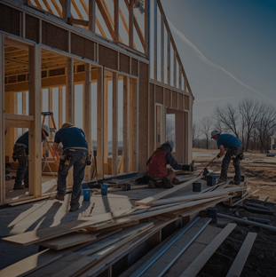 A team of workers is building a house